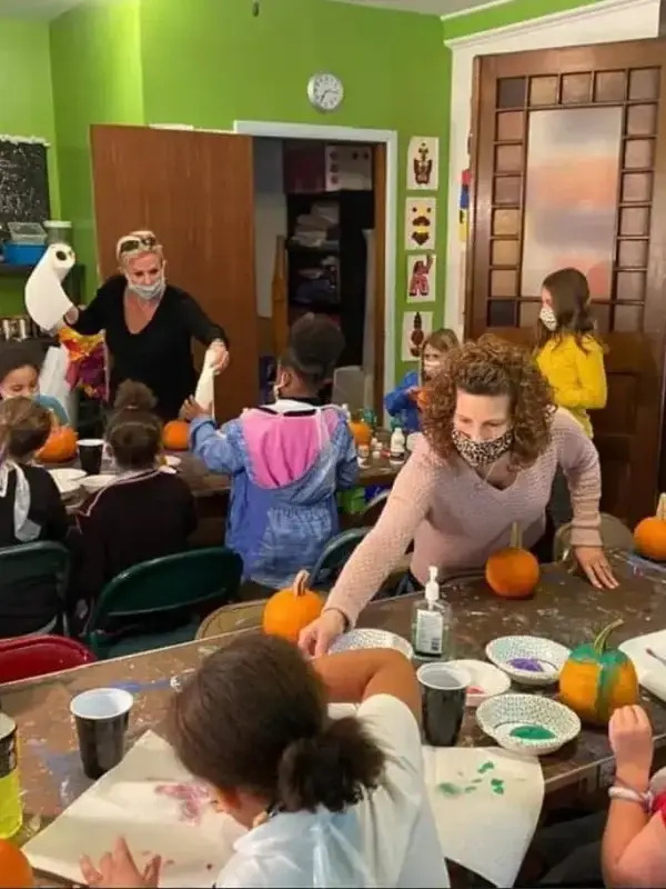 Children painting pumpkins at the Sycamore Youth Center